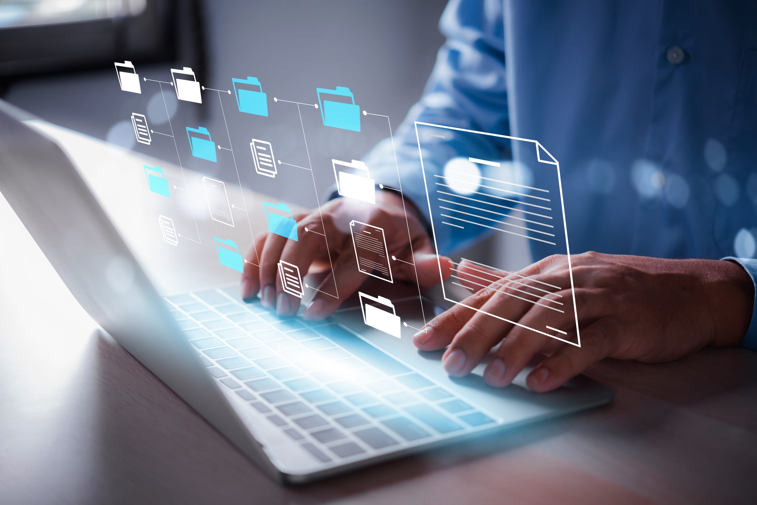 business man using laptop access files document on viritual screen, document management system